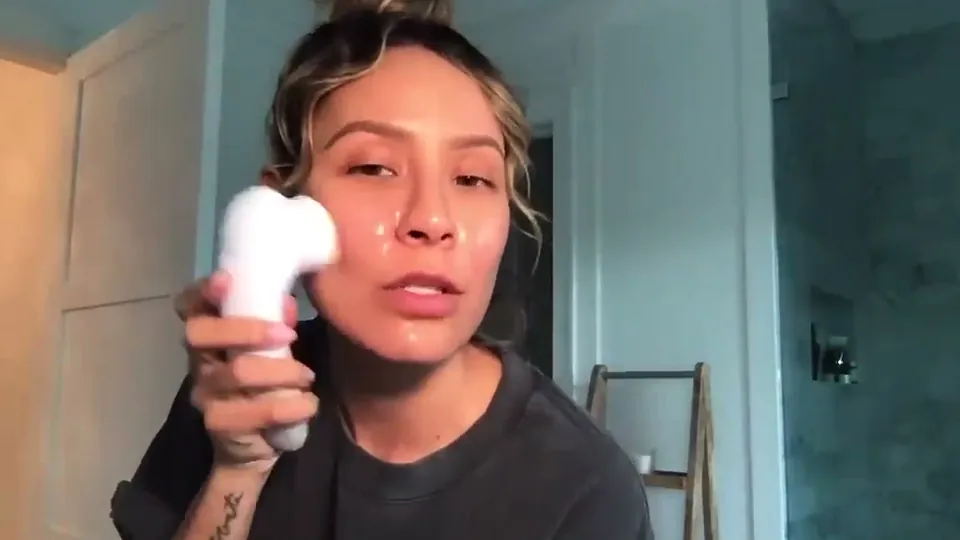 Desi Perkins for Vanity Planet, a still from the sponsored video on cleansing brush